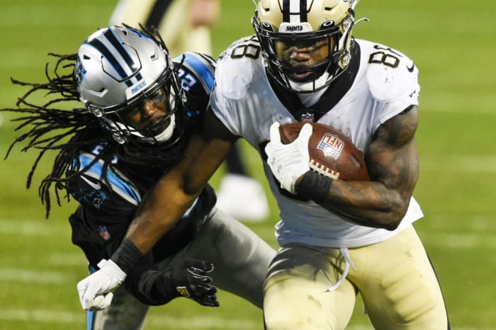 Jan 3, 2021; Charlotte, North Carolina, USA; Saints running back Ty Montgomery (88) with the ball as Carolina cornerback Donte Jackson (26). Mandatory Credit: Bob Donnan-USA TODAY Sports